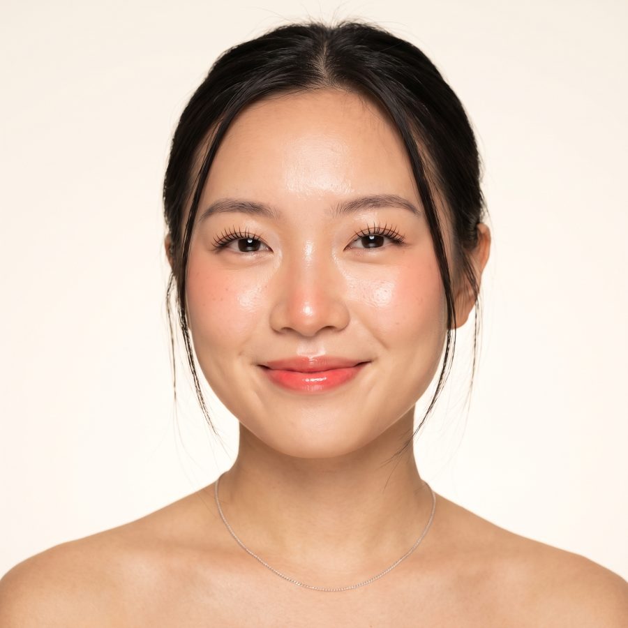 A client smiling into the camera after a lash treatment.